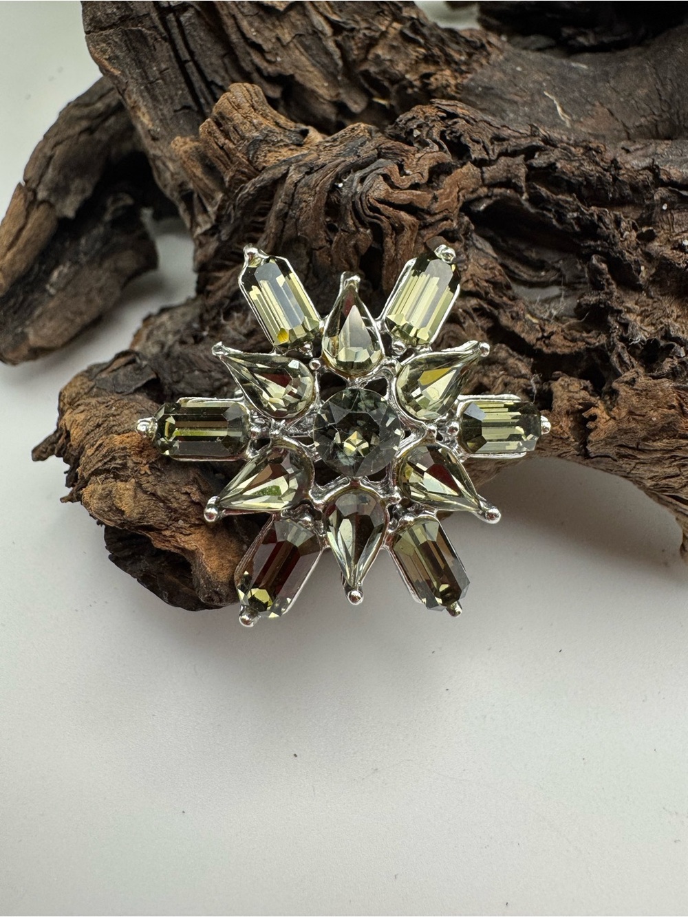 Vintage silver-tone brooch with smoky green-gray glass stones, EUC. 1 1/4”.